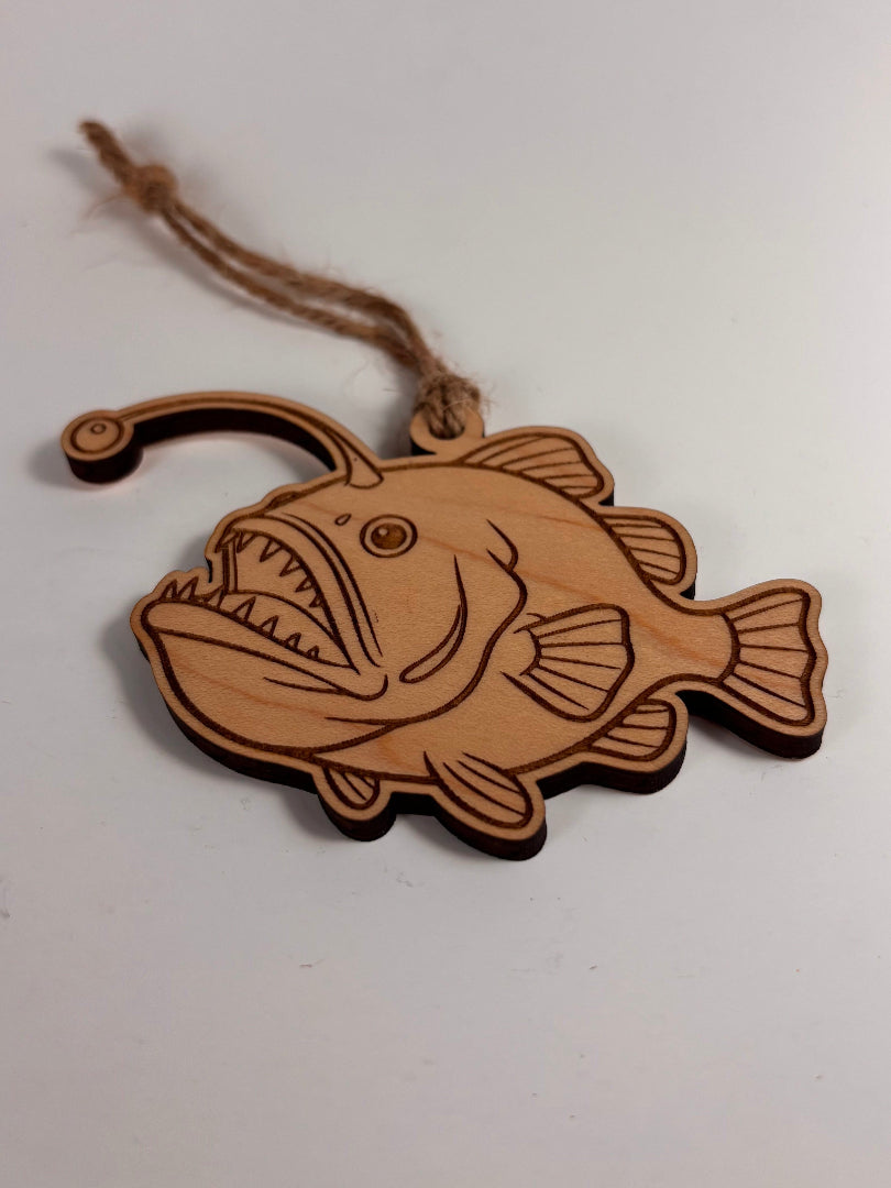 Wooden Anglerfish-shaped ornament on a white background
