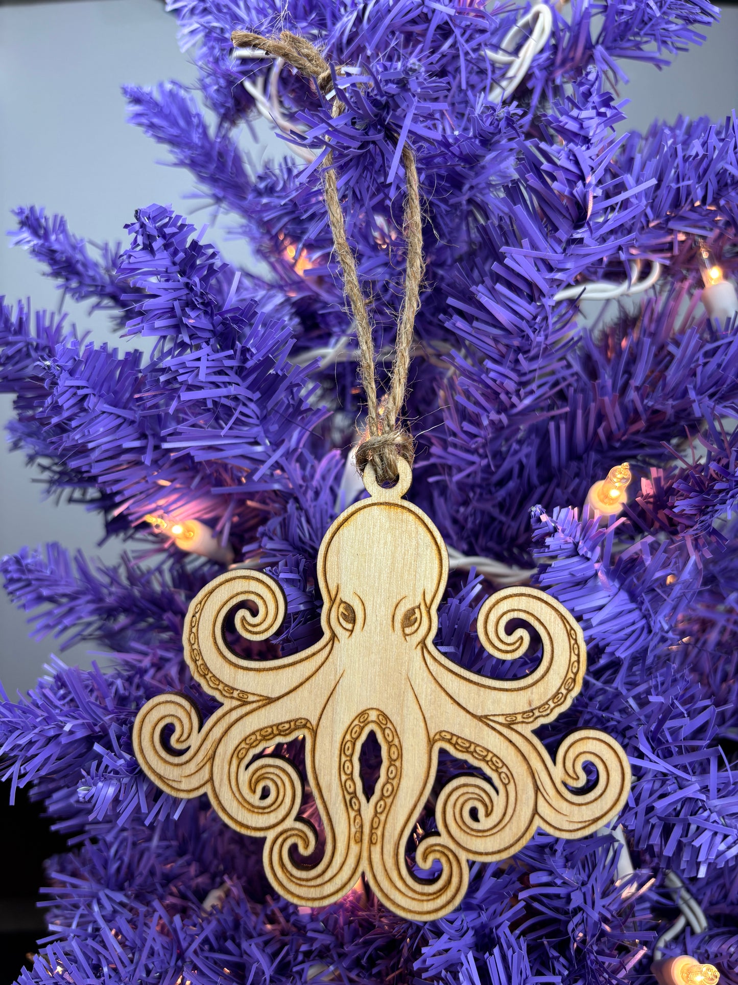 Wooden octopus ornament on a purple Christmas tree