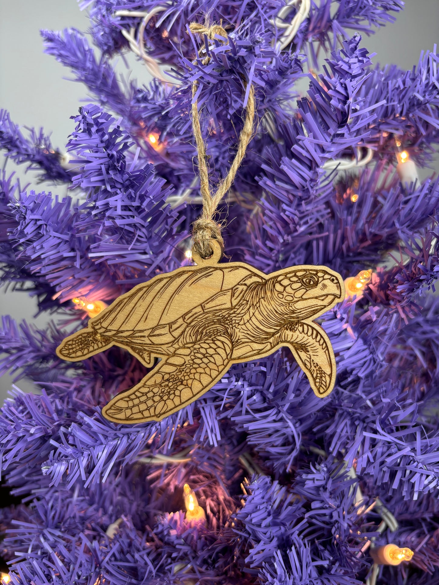 Wood turtle ornament on a purple Christmas tree